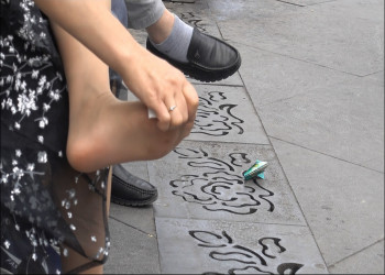 Short-haired woman in flower-[patterned dress